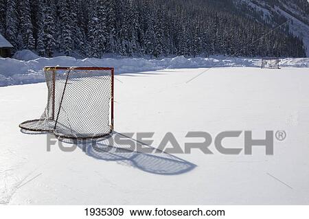 Hockey Net On Outdoor Ice Rink; Lake Louise, Alberta, Canada View Large Photo Image Stock Photo - Hockey Net On Outdoor Ice Rink; Lake Louise, Alberta, Canada. Fotosearch