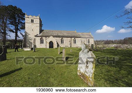 Stock Image - Holy Trinity Church And Cemetery; Coverham Yorkshire England. Fotosearch