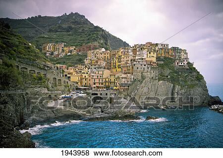 Stock Photo - Houses On A Rock Ledge Along The Coast; Manarola Liguria Italy. Fotosearch
