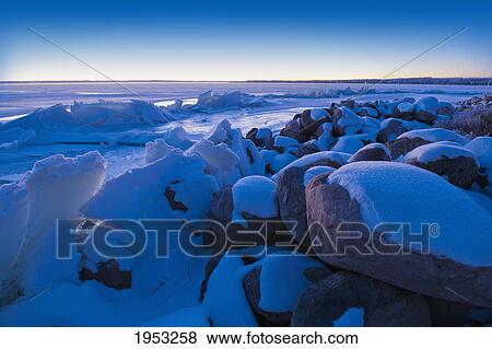 ice pushed up on the shoreline of the lake; pigeon lake alberta canada View Large Photo Image Stock Photo - ice pushed up on the shoreline of the lake; pigeon lake alberta canada. Fotosearch