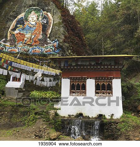 Image Of Guru Rimpoche Above Prayer Flags And A Building; Begama Village, Punakha District, Bhutan View Large Photo Image Picture - Image Of Guru Rimpoche Above Prayer Flags And A Building; Begama Village, Punakha District, Bhutan. Fotosearch