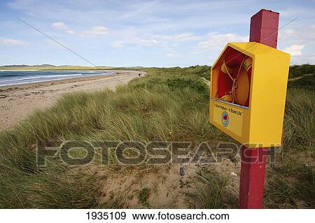Life Preserver Box At Beach On Pollan Bay; Pollan Beach, County Donegal, Ireland View Large Photo Image Stock Photo - Life Preserver Box At Beach On Pollan Bay; Pollan Beach, County Donegal, Ireland. Fotosearch