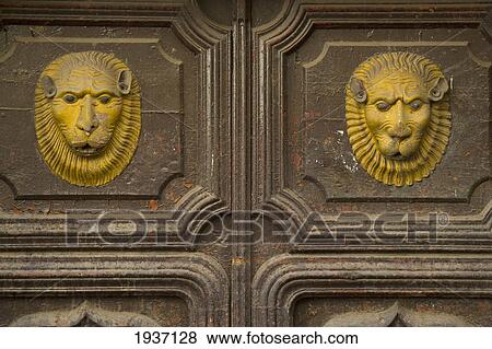 Lion Faces Decorating A Weathered Door; Cusco Peru View Large Photo Image Stock Photo - Lion Faces Decorating A Weathered Door; Cusco Peru. Fotosearch