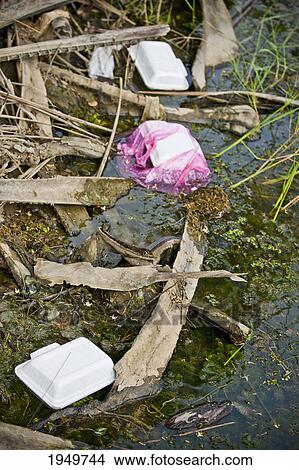 Picture - litter at the water's edge; melaka malaysia. Fotosearch