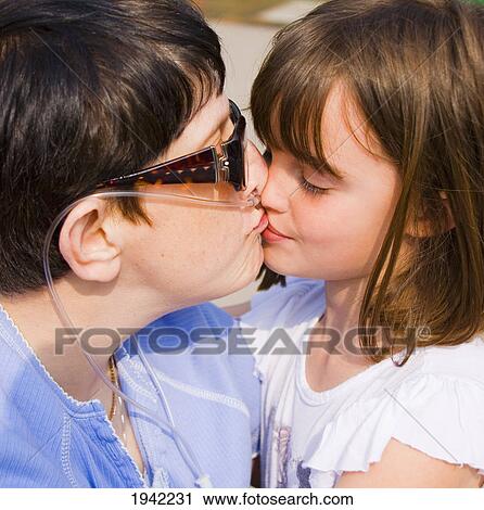 Little Girl Gives Her Special Friend A Kiss; Bolton Lancashire England View Large Photo Image Stock Image - Little Girl Gives Her Special Friend A Kiss; Bolton Lancashire England. Fotosearch
