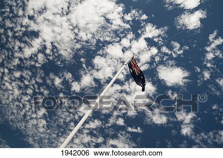 Stock Photograph - Low Angle View Of Australian Flag Against Sky; Victoria Park Perth Western Australia. Fotosearch