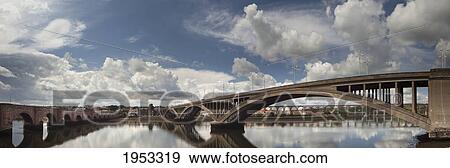 Stock Photo - many bridges with clouds reflected in the water; berwick northumberland england. Fotosearch