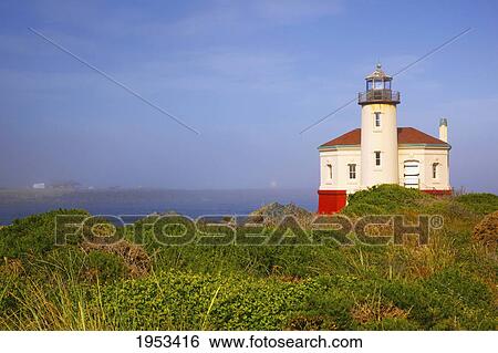 Stock Photograph - morning light adds beauty to coquille river lighthouse; bandon oregon united states of america. Fotosearch