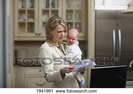 Mother With Baby Stressing Over Household Bills; Jordan Ontario Canada View Large Photo Image Stock Image - Mother With Baby Stressing Over Household Bills; Jordan Ontario Canada. Fotosearch