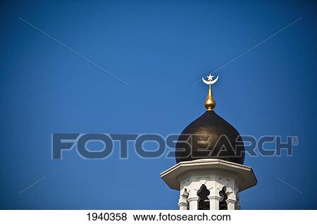 One Of The Minarets At The Kapitan Keling Mosque Against A Blue Sky; Penang Malaysia View Large Photo Image Stock Photo - One Of The Minarets At The Kapitan Keling Mosque Against A Blue Sky; Penang Malaysia. Fotosearch