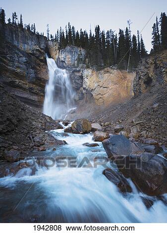 Stock Photo - Panther Falls Plunges Over A Cliff In Banff; Banff Alberta Canada. Fotosearch
