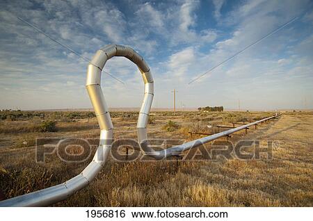 pipe in a unique shape in a grassy area; mckittrick california united states of america View Large Photo Image Stock Photograph - pipe in a unique shape in a grassy area; mckittrick california united states of america. Fotosearch