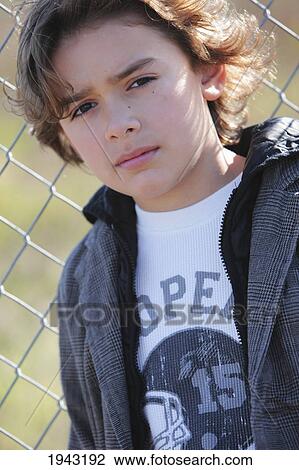 Portrait Of A Boy Against A Chain-Link Fence; Troutdale Oregon United States Of America View Large Photo Image Stock Image - Portrait Of A Boy Against A Chain-Link Fence; Troutdale Oregon United States Of America. Fotosearch