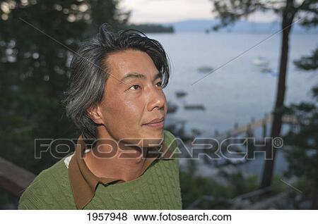 portrait of a man with lake tahoe in the background; lake tahoe california united states of america View Large Photo Image Stock Photo - portrait of a man with lake tahoe in the background; lake tahoe california united states of america. Fotosearch