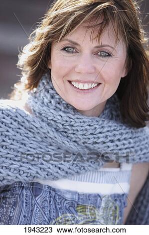 Stock Image - Portrait Of A Woman Wearing A Blue Scarf; Troutdale Oregon United States Of America. Fotosearch