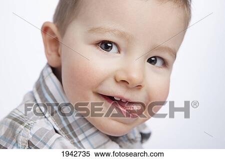 Portrait Of A Young Boy With His Tongue Sticking Out; Edmonton Alberta Canada View Large Photo Image Stock Photography - Portrait Of A Young Boy With His Tongue Sticking Out; Edmonton Alberta Canada. Fotosearch