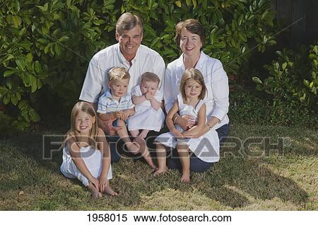 Stock Photography - portrait of grandparents with grandchildren on the grass; moraga california united states of america. Fotosearch