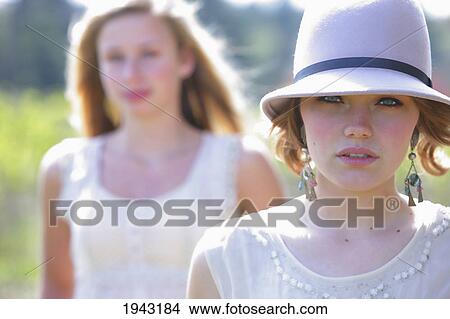Portrait Of Two Teenage Girls; Troutdale Oregon United States Of America View Large Photo Image Picture - Portrait Of Two Teenage Girls; Troutdale Oregon United States Of America. Fotosearch
