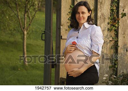 Pregnant Woman In A Garden; Dublin Ireland View Large Photo Image Stock Photo - Pregnant Woman In A Garden; Dublin Ireland. Fotosearch