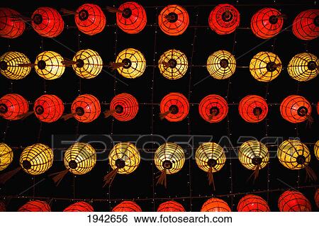 Stock Photograph - Red And Yellow Chinese Lanterns Hanging From The Ceiling; Chiang Mai Thailand. Fotosearch