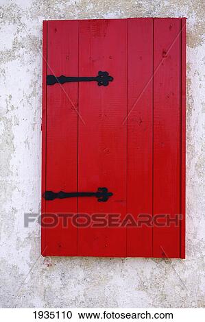 Stock Image - Red Window Shutter On A Cottage; Bloody Foreland, County Donegal, Ireland. Fotosearch
