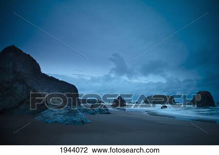Stock Image - Rock Formations Along The Rugged Coast Of The Pacific Ocean; Bandon Oregon United States Of America. Fotosearch