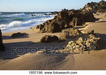 Stock Photograph - Rocky Beach; Chiclana De La Frontera Spain. Fotosearch