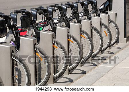 row of bicycles parked in a rack; montreal quebec canada View Large Photo Image Stock Image - row of bicycles parked in a rack; montreal quebec canada. Fotosearch