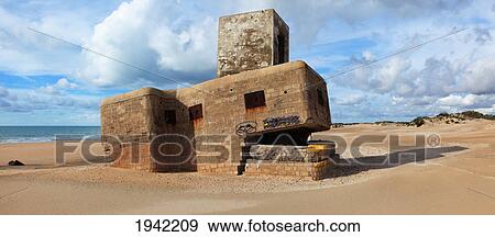 Stock Photo - Ruins Of A Stone Structure On The Beach Near San Fernando; Andalucia In Spain. Fotosearch