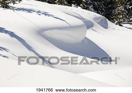 Stock Photograph - Shadows Made By Snowdrifts; Waterton Alberta Canada. Fotosearch
