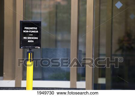 Stock Image - sign designating a no smoking area; montreal quebec canada. Fotosearch