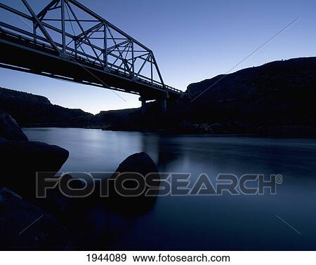 Silhouette Of A Bridge Going Over A River At Dusk; New Mexico United States Of America View Large Photo Image Stock Photo - Silhouette Of A Bridge Going Over A River At Dusk; New Mexico United States Of America. Fotosearch