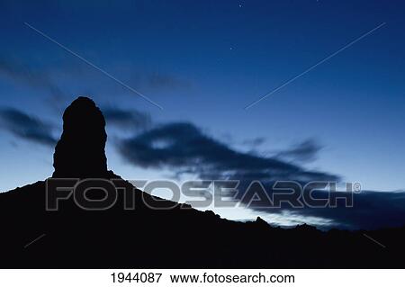 Stock Photo - Silhouette Of A Rock Formation At Dusk; Trona California United States Of America. Fotosearch