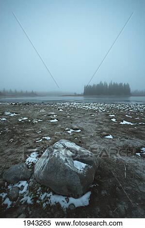 Snow On The Shore Of Astotin Lake On A Foggy Evening; Edmonton Alberta Canada View Large Photo Image Stock Photography - Snow On The Shore Of Astotin Lake On A Foggy Evening; Edmonton Alberta Canada. Fotosearch