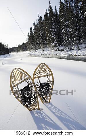 Snowshoes By River; Lake Louise, Alberta, Canada View Large Photo Image Stock Image - Snowshoes By River; Lake Louise, Alberta, Canada. Fotosearch