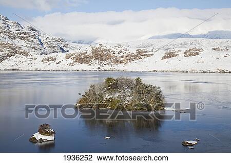 Stock Image - Snowy Shore By Barfinnihy Lake In Killarney National Park; Killarney County Kerry Ireland. Fotosearch