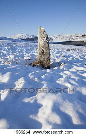 Standing Stone In A Snow Covered Field In Winter Near Blackwater; County Kerry Ireland View Large Photo Image Picture - Standing Stone In A Snow Covered Field In Winter Near Blackwater; County Kerry Ireland. Fotosearch