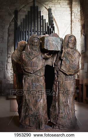 Stock Image - statue of mourners carrying a coffin; lindisfarne northumberland england. Fotosearch