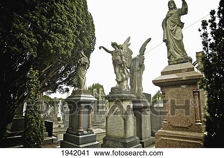 Statues On Graves In Glasnevin Cemetery; Dublin County Dublin Ireland View Large Photo Image Stock Image - Statues On Graves In Glasnevin Cemetery; Dublin County Dublin Ireland. Fotosearch