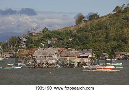 Stock Image - Stilt Houses Sit Above The Water; Bais, s, Philippines. Fotosearch