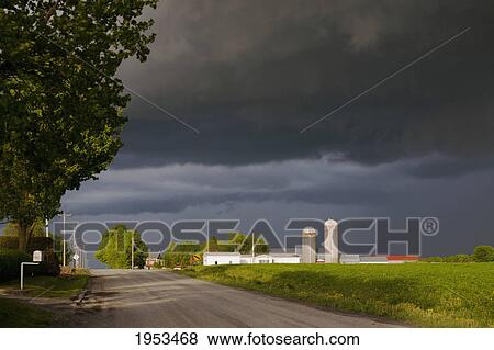 Stock Photo - storm clouds over a farm; farnham quebec canada. Fotosearch