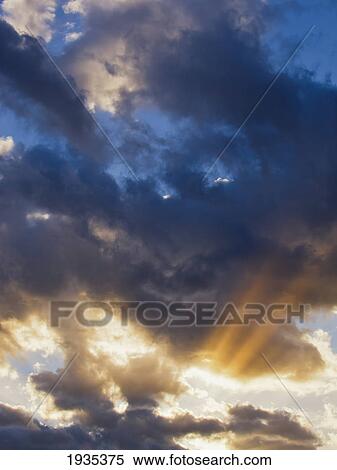Sun Rays Bursting Out From Behind Clouds View Large Photo Image Stock Photography - Sun Rays Bursting Out From Behind Clouds. Fotosearch