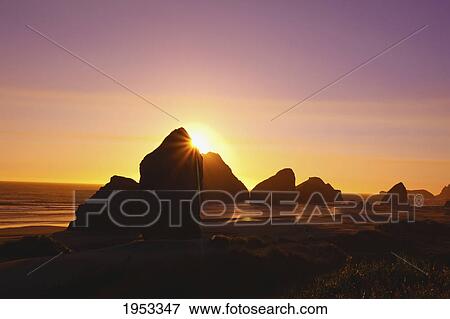 sunset behind rock formations at cape sebastian state park; oregon united states of america View Large Photo Image Stock Photo - sunset behind rock formations at cape sebastian state park; oregon united states of america. Fotosearch