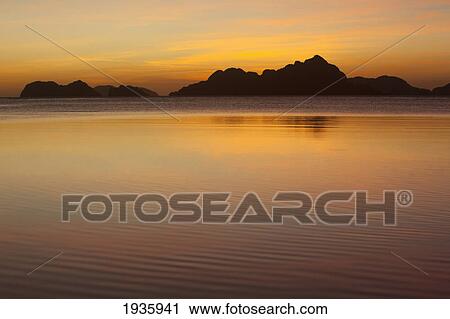 Stock Image - Sunset View Of Tropical Islands From The Beaches Of Corong Corong; El Nido, Bacuit Archipelago, Palawan, Philippines. Fotosearch