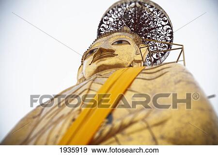 Stock Photo - Tall Standing Thai Buddha; Bangkok, Thailand. Fotosearch
