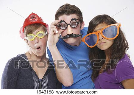 Teenagers Wearing Funny Disguises; Troutdale Oregon United States Of America View Large Photo Image Stock Photo - Teenagers Wearing Funny Disguises; Troutdale Oregon United States Of America. Fotosearch