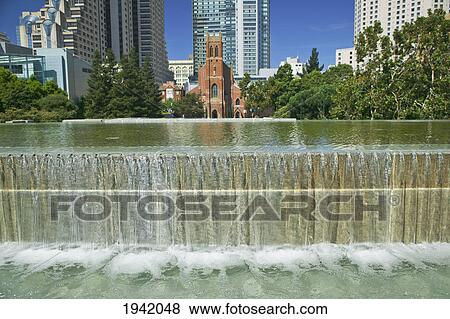 Terrace Fountain At Yerba Buena Gardens And St. Patrick's Church In The Background; San Francisco California United States Of America View Large Photo Image Stock Photo - Terrace Fountain At Yerba Buena Gardens And St. Patrick's Church In The Background; San Francisco California United States Of America. Fotosearch