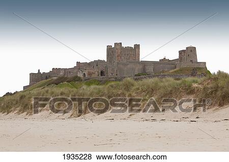 Stock Photo - The Bamburgh Castle On The Beach Near Berwick-Upon-Tweed; England, United Kingdom. Fotosearch