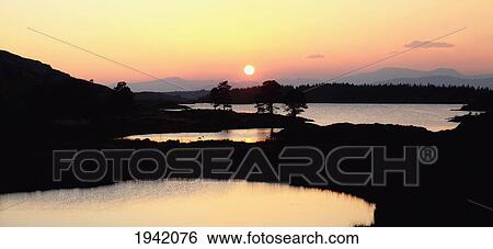 The Cloonee Lakes At Sunset; Tuosist County Kerry Ireland View Large Photo Image Stock Photograph - The Cloonee Lakes At Sunset; Tuosist County Kerry Ireland. Fotosearch