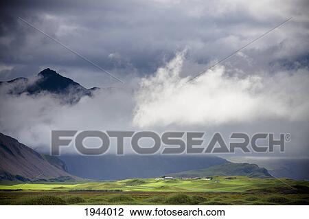 The Peak Of A Mountain Seen Through Low Lying Clouds; Iceland View Large Photo Image Stock Image - The Peak Of A Mountain Seen Through Low Lying Clouds; Iceland. Fotosearch